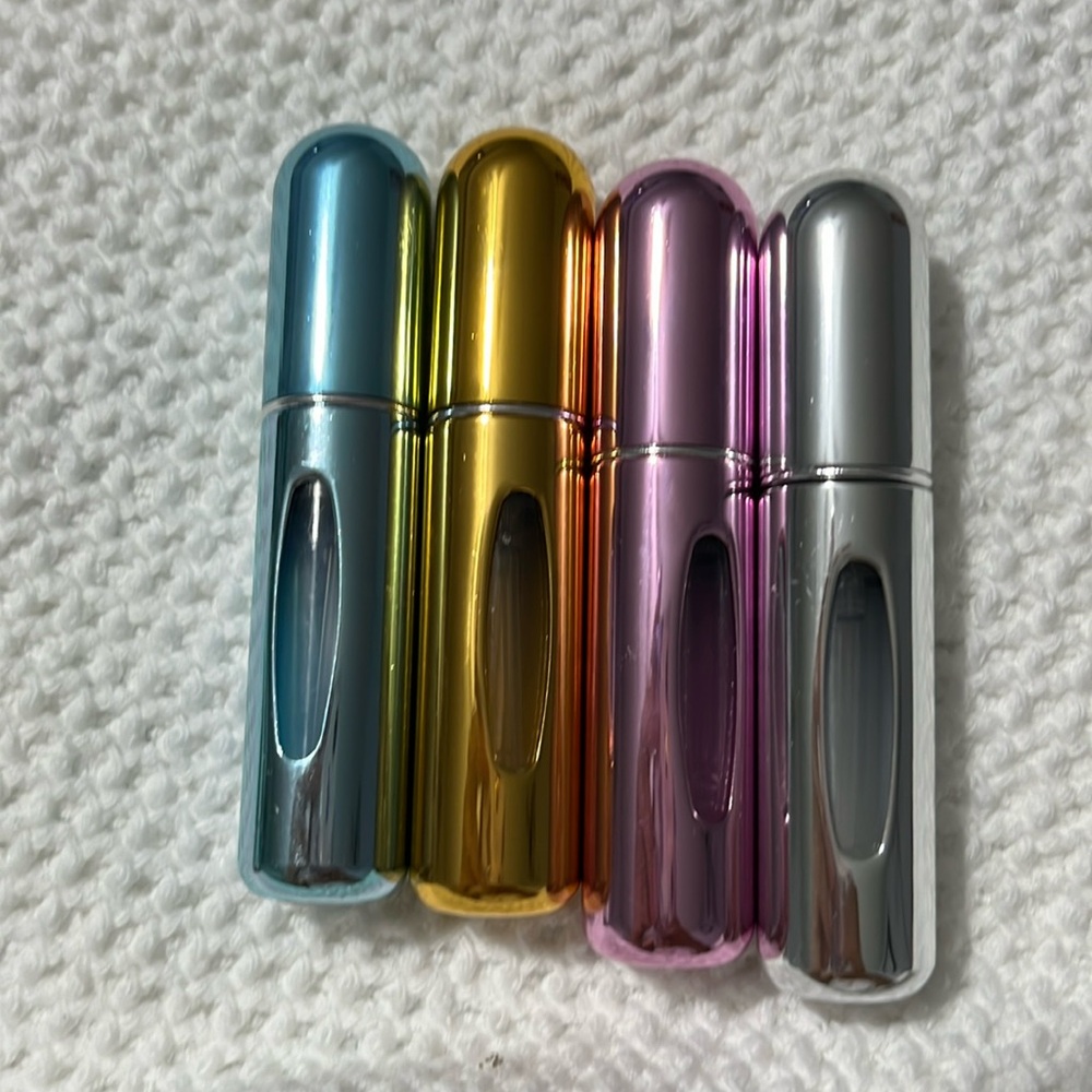 Refillable perfume atomizers